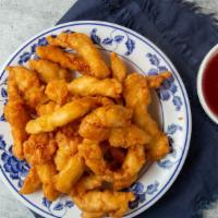 Sweet & Sour Chicken · Chicken breast fried to golden brown, toss-cooked with bell peppers, onions, carrots and pin...