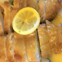 Lemon Chicken · White meat breast deep-fried covered with a fresh lemon sauce and served on the back of shre...