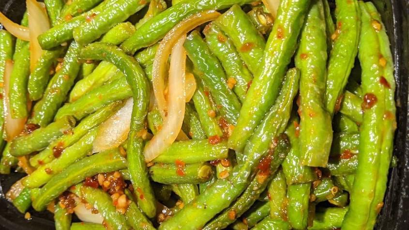 Hot Spicy Green Beans · Fresh tender string beans sauteed and braised in a spicy garlic sauce.