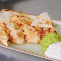 Milagros Quesadilla · Marinated flank steak or pulled spit-roasted chicken, cotija, Oaxaca & manchego cheeses, car...