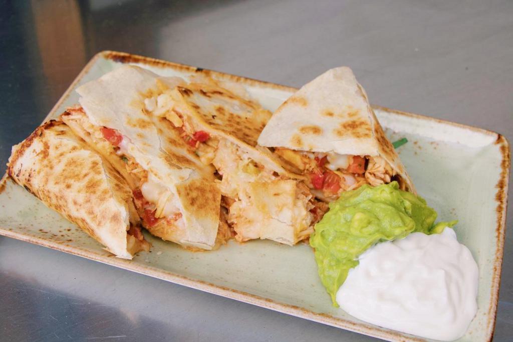 Milagros Quesadilla · Marinated flank steak or pulled spit-roasted chicken, cotija, Oaxaca & manchego cheeses, caramelized onions, pico de gallo, spicy chipotle BBQ sauce