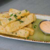 Crispy Yucca Fries · Flash fried, tossed with chili-salt & cilantro, served with Osuna dipping sauce