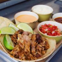 Family Style Roasted Carnitas Tacos - 6 · Pint Coleman Ranch roasted pork carnitas, two white corn tortillas per taco, and all the top...