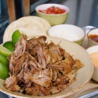 Family Style Roasted Carnitas Tacos - 12 · Coleman Ranch roasted pork carnitas, two white corn tortillas per taco, and all the toppings...