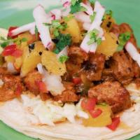 Al Pastor Taco · Grilled red chili marinated Coleman ranch pork, roasted pineapple salsa, cilantro