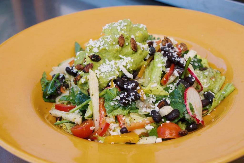 Chopped Salad · Baby spinach, kale, and romaine, black beans, jicama, peppers, guacamole, cotija cheese, toasted pumpkin seeds, cilantro, serrano-lime vinaigrette.. add Grilled Carne Asada $6. add Braised Pitman Farms Chicken $4. add Lemon Shrimp $6