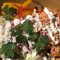 Chipotle Chicken Bowl · Chipotle Tinga marinated chicken, cilantro brown rice, fire roasted peppers, marinated red o...