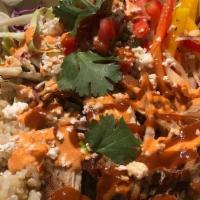 Roasted Carnitas Bowl · Slow roasted pork carnitas, cilantro-lime brown rice, roasted peppers, chipotle crema, spicy...