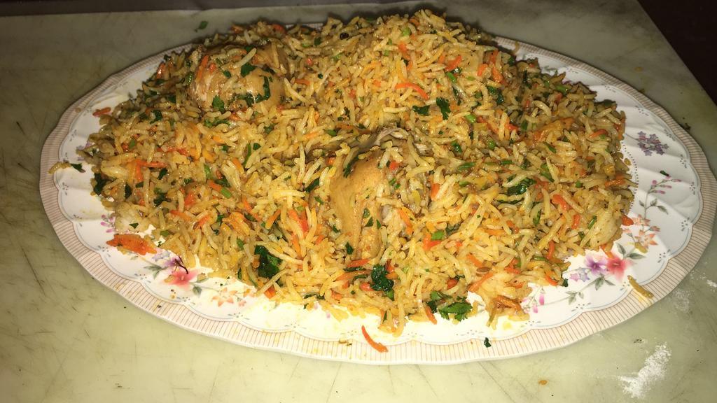 6. Chicken Biriyani · Chicken cooked with exotic spices and saffron flavored basmati rice.