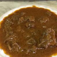 20. Bhunna Ghosht · Medium hot lamb cooked with a hint of garlic and ginger over a bed of onions and special spi...
