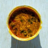 25. Daal Masala (Yellow) · Lentil delicately tempered and seasoned with selected spices.