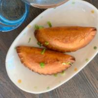 2 Pieces of Chicken Empanada · Two chicken and rice filling empanada, authentic guam style, a taste of the island food.