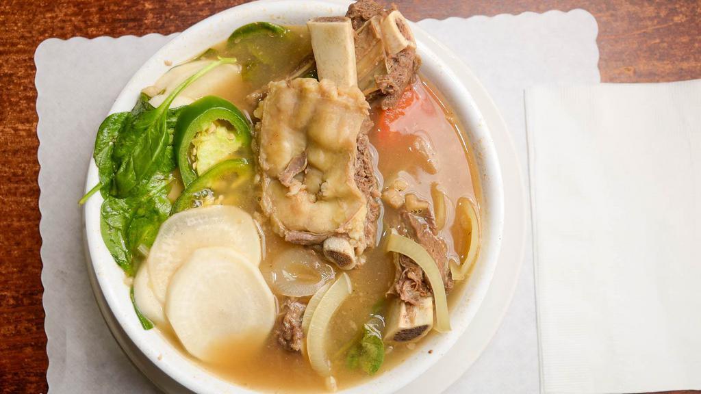 Sinigang · Traditional tamarind-based sour soup with your choice of pork ribs, beef ribs, shell-on shrimp or boneless fish belly and seasonal vegetables.