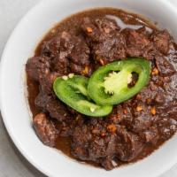 Dinuguan · A savory pork stew cooked in garlic, vinegar, jalapenos, and pork blood gravy.