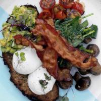 Bl Big Brekkie · Avocado smash on toasted multigrain served with two poached eggs, smoked bacon, roasted toma...