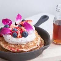 Lemon Ricotta Pancakes · Lemon ricotta pancakes with whipped ricotta, fresh berries, citrus curd, edible petals, free...