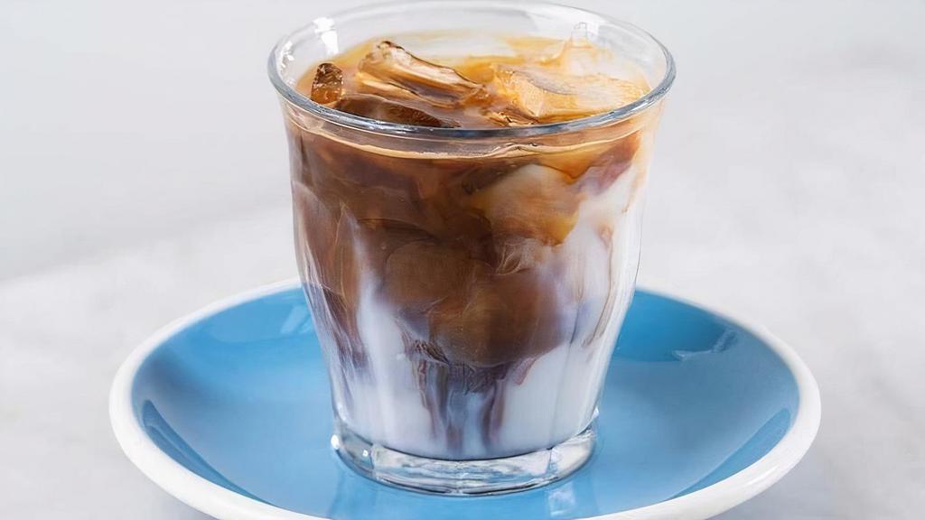 Iced Magic · A stronger, less diluted spin on an iced latte – two espresso shots with ice and milk.