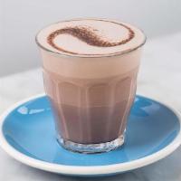 Hot Chocolate · Deliciously rich cocoa spun in a pitcher with steamed, silky textured milk. Served with choc...