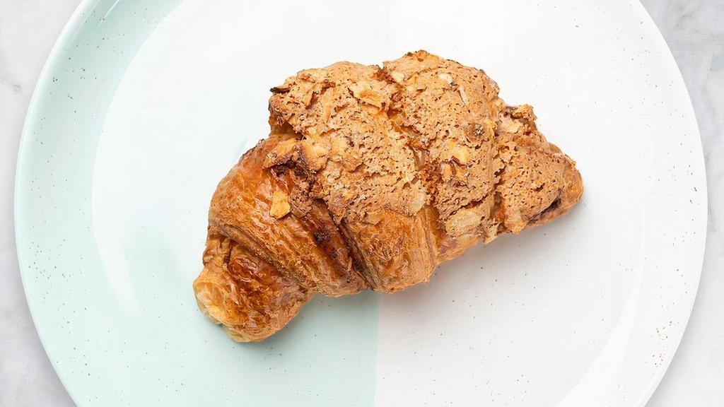 Almond Croissant · Freshly baked almond croissants. Light and airy layers of flaky buttery pastry with toasted slivered almonds.