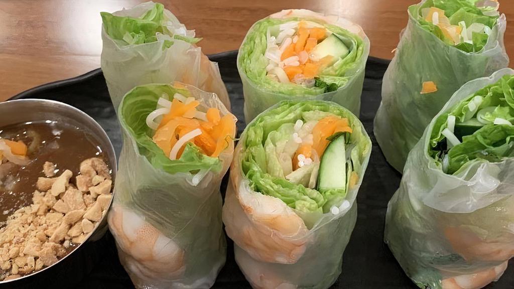 Shrimp Spring Rolls · Poached shrimp, vermicelli noodles, lettuce, cucumber, pickled carrots, pickled daikon, freshly wrapped with rice paper. Served with a peanut hoisin sauce.