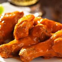 Buffalo Wings · Mouthwatering Golden Chicken wings, served in a Buffalo heat flavor.