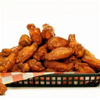 The Classic HOT Wings · Mouthwatering Golden Chicken wings, served with a Kick of Heat.