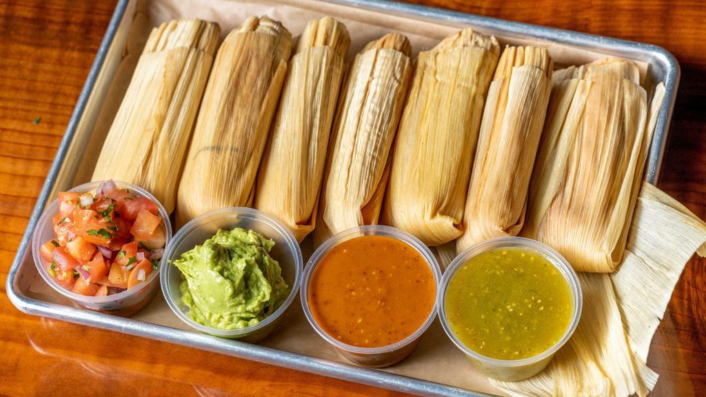 Tamale Combination Plate · Served with either two Tamales. With a side of beans, rice, and lettuce topped with pico de gallo, guacamole, and sour cream.