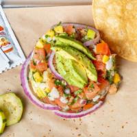 House Ceviche · Your choice of diced fish, shrimp, or both. Marinated in lime juice, tossed with tomatoes,re...
