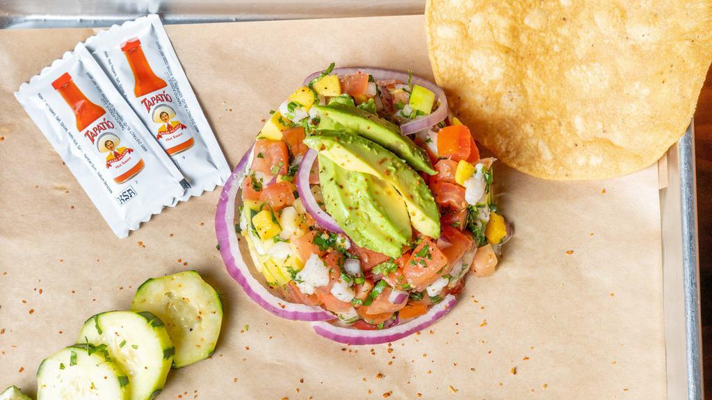 House Ceviche · Your choice of diced fish, shrimp, or both. Marinated in lime juice, tossed with tomatoes,red onions, cucumber, avocado,fresh cilantro, and juicy mango. With a side of 1 tostada.