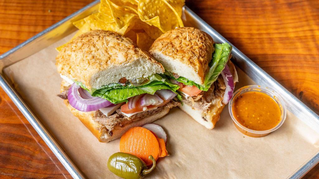 Torta · Toasted Mexican Sandwich with your choice of meat, mayo, refried beans, queso fresco, lettuce, tomatoes, onions, jalapenos, and guacamole