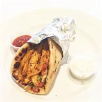 Chicken Shawarma Wrap · Thinly-sliced chicken shawarma, lettuce, onions, tomatoes, yogurt sauce, wrapped with pita b...