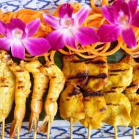 9. Combination Satay · Two of Each Satay Skewers (Chicken, Beef, Pork,Prawns, Calamari) served with peanut sauce an...