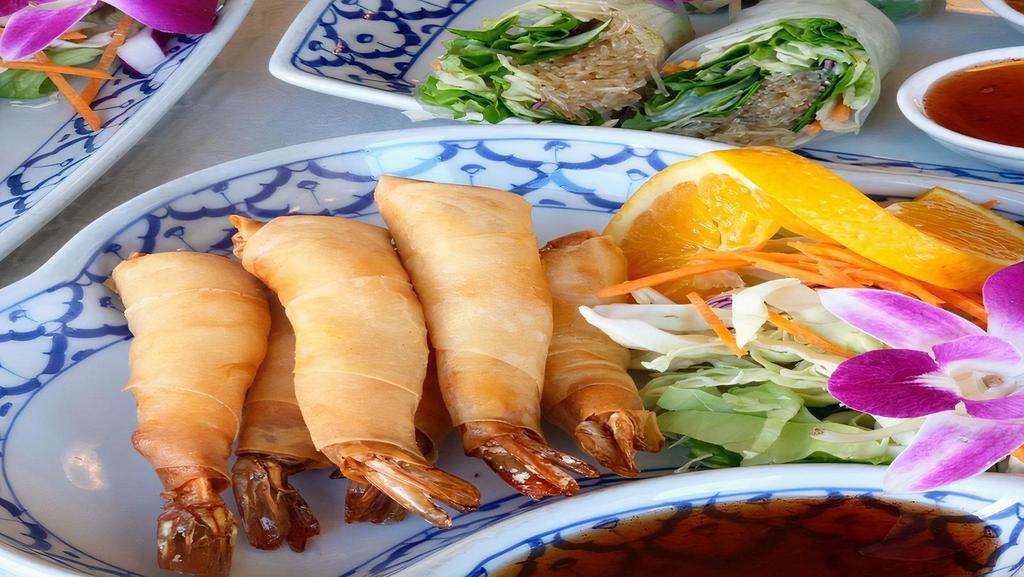 5. Shrimp Rolls · Deep fried shrimp wrapped in egg roll skins, served with homemade sweet and sour sauce.