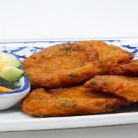 6. Fish Cakes · Ground fish with a touch of curry paste, sliced green beans, deep fried and serve with peanu...