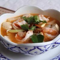 12. Tom Yum Goong · Hot and sour prawn soup with onions, mushrooms, lemongrass, kaffir lime leaves, cilantro and...