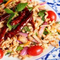 15. Larb Salad · Spicy. Ground chicken or beef cooked and seasoned with red onions, mint leaves, cilantro, gr...