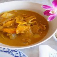 25. Yellow Curry · Spicy. Sliced chicken or pork or beef cooked in yellow curry paste, coconut milk, carrot, on...