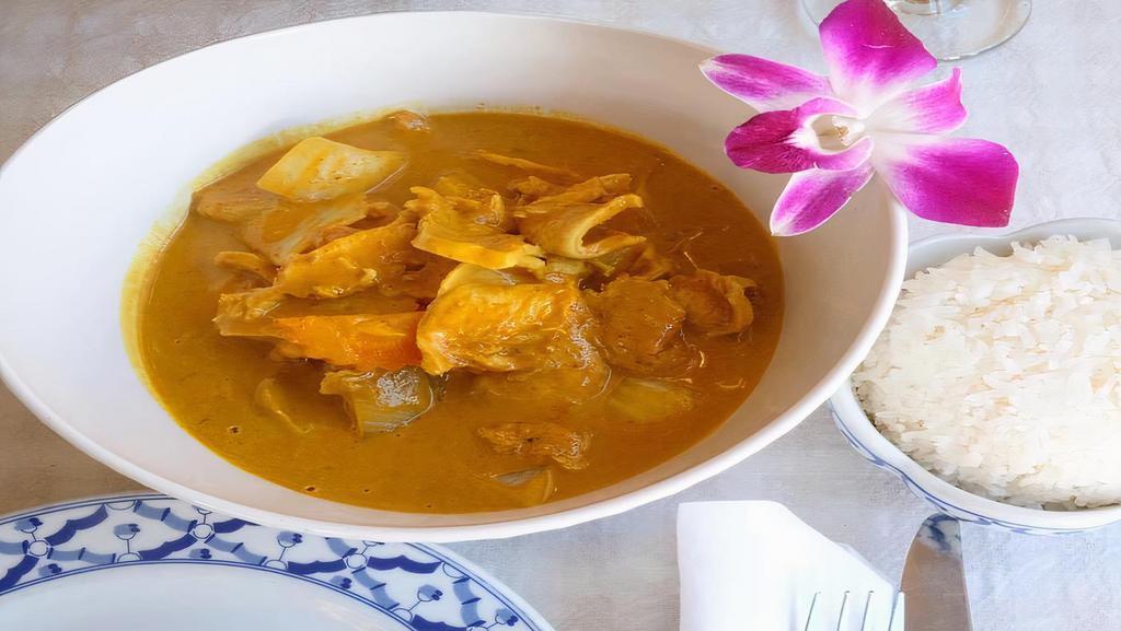 25. Yellow Curry · Spicy. Sliced chicken or pork or beef cooked in yellow curry paste, coconut milk, carrot, onion and potatoes.