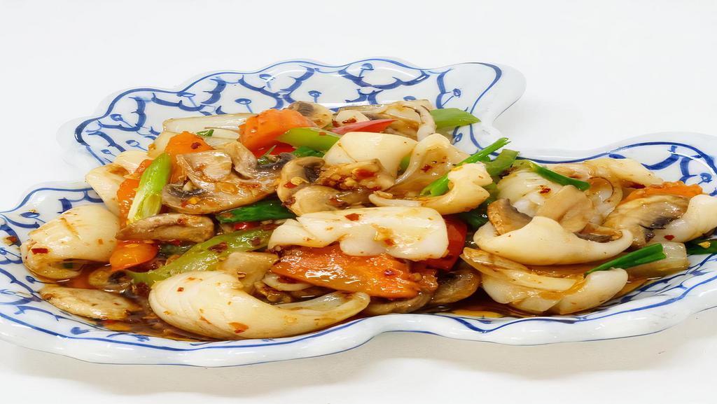 56. Fresh Chili Calamari · Spicy. Calamari sauteed with fresh chili, mushrooms, carrot, bell peppers, onion and green onion.