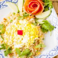 Crab Fried Rice · Thai Fried rice with Crab meat, Peas, Carrots, Egg and Onion.