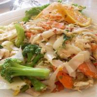 72. Pad Kee Maow · Pan fried rice noodles with egg, tomatoes, chili, vegetables, & sweet basil with your choice...