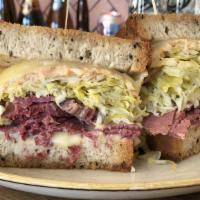 Shorty's Tall Reuben · House Cured Corned Beef, Sauerkraut, Russian, Swiss, Toasted Rye, Fries