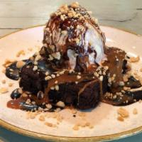 Brownie Sundae · Peanut butter swirl ice cream, chocolate, caramel, crushed peanuts.