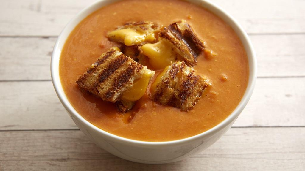 Tomato Basil Soup · Comes with grilled cheese croutons.