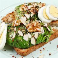 Avocado Toast · Enjoy our popular Avocado Toast. Two slices of nut & grain bread, topped with half an avocad...