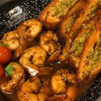 BBQ Shrimp · with butter, garlic, lemon, black pepper, worcestershire sauce and crostini