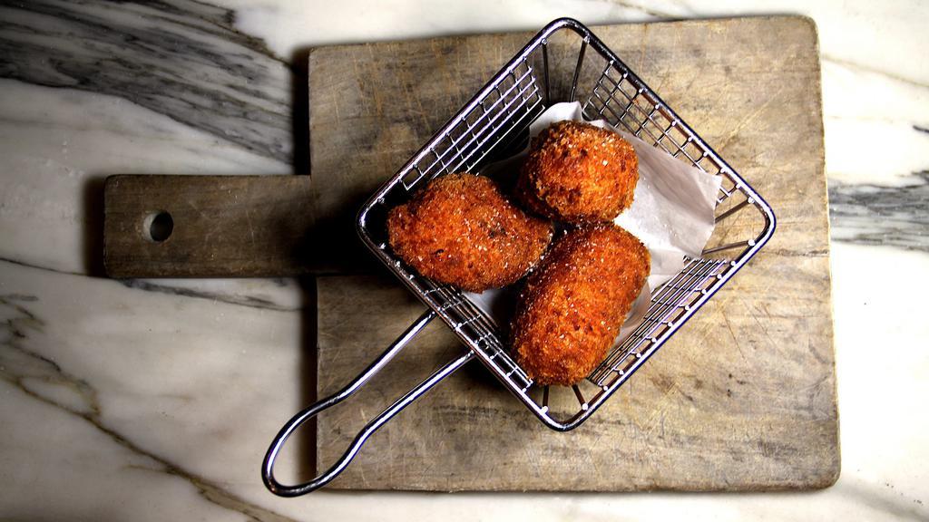 Arancini · Roman-style panko-crusted fried rice balls.