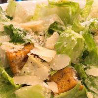 Caesar Salad · Organic romaine lettuce shaved parmigiano, croutons & garlic aioli.