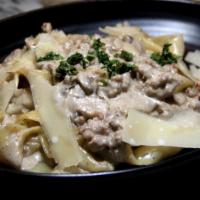 Pappardelle Sausage & Truffle Cream · House made Pappardelle served with Italian sausages,  mushrooms in black truffle cream sauce