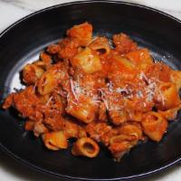 Rigatoni Boscaiola · Rigatoni, mushroom, onion, Italian sausage, cream, or tomato sauce.